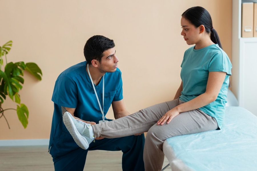 Vein specialist performing an ultrasound-guided leg vein evaluation in Palm Beach Gardens